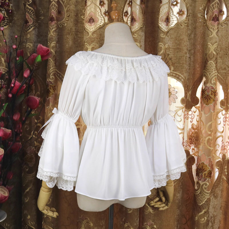 This elegant chiffon blouse features dramatic ruffled sleeves and a delicate bow accent, creating a romantic silhouette. The lightweight fabric drapes softly for effortless layering under jumpers or dresses. With its refined details and flowing texture, it blends vintage-inspired grace with modern Lolita charm, perfect for adding sophistication to any coordinate.