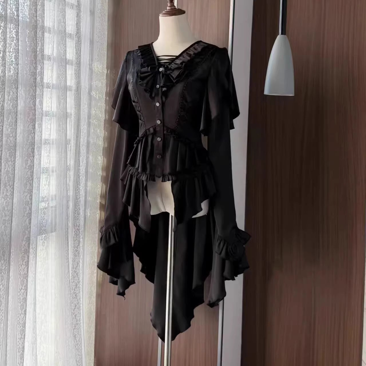 This Lolita blouse masterfully merges vintage elegance with medieval charm, crafted in a striking prince-style design. Rendered in timeless black and white, it features meticulous tailoring for a structured yet comfortable loose fit. Ideal for layering, cosplay, or themed events, it pairs effortlessly with skirts or trousers. This piece embodies dark romanticism, blending historical inspiration with contemporary Gothic Lolita sophistication for a truly versatile statement.