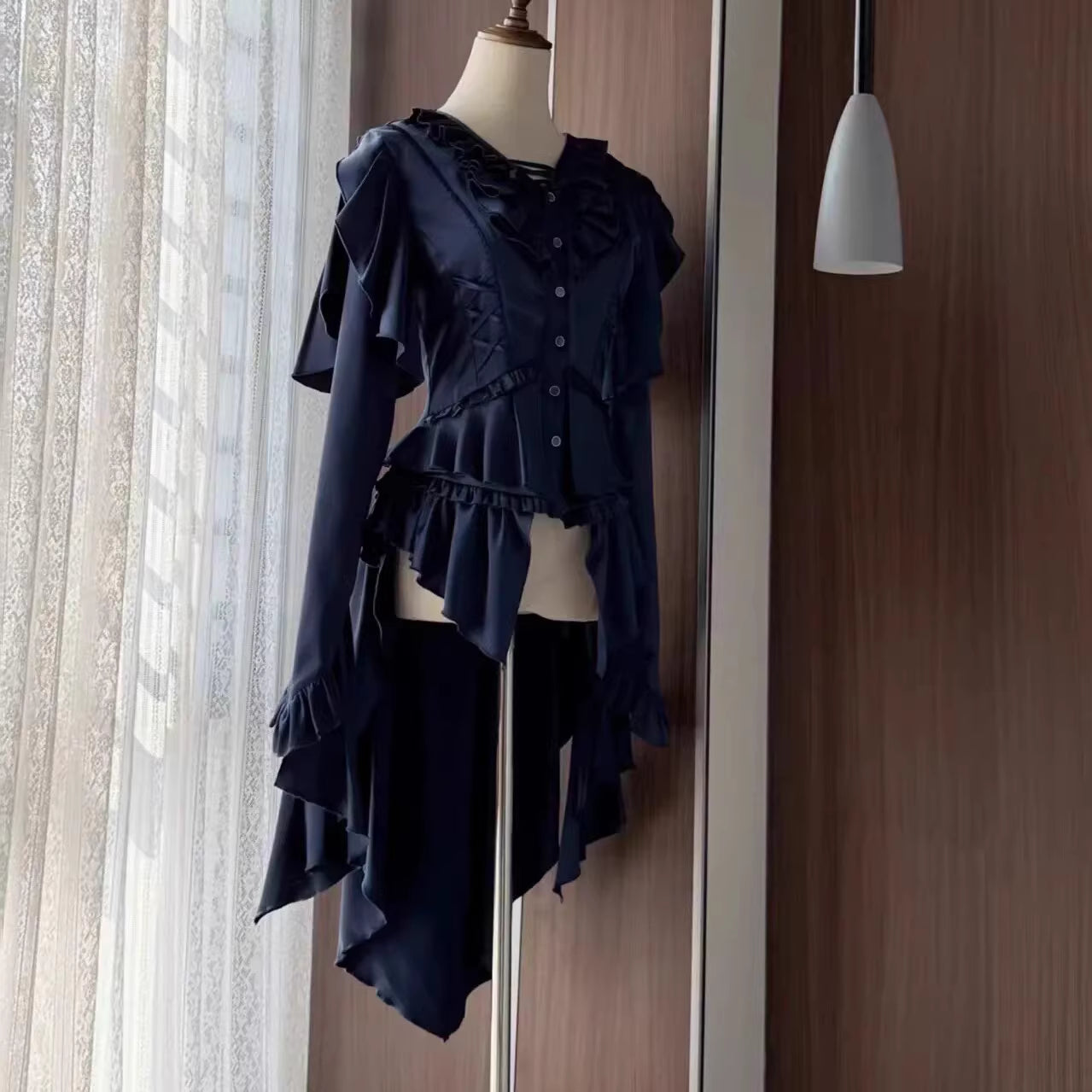 This Lolita blouse masterfully merges vintage elegance with medieval charm, crafted in a striking prince-style design. Rendered in timeless black and white, it features meticulous tailoring for a structured yet comfortable loose fit. Ideal for layering, cosplay, or themed events, it pairs effortlessly with skirts or trousers. This piece embodies dark romanticism, blending historical inspiration with contemporary Gothic Lolita sophistication for a truly versatile statement.