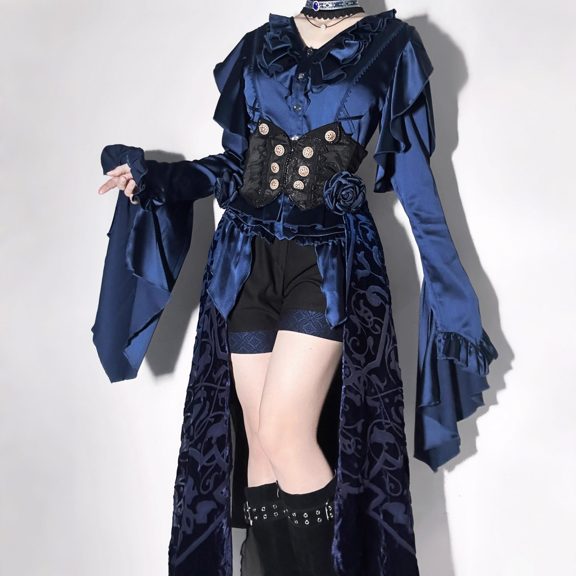 This Lolita blouse masterfully merges vintage elegance with medieval charm, crafted in a striking prince-style design. Rendered in timeless black and white, it features meticulous tailoring for a structured yet comfortable loose fit. Ideal for layering, cosplay, or themed events, it pairs effortlessly with skirts or trousers. This piece embodies dark romanticism, blending historical inspiration with contemporary Gothic Lolita sophistication for a truly versatile statement.