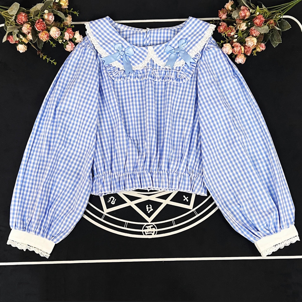 Crafted from breathable cotton, this charming short-sleeve blouse features a classic Peter Pan collar and delicate bow tie. The playful plaid pattern in multiple colors offers versatile styling for both Lolita and JK fashion. Its lightweight comfort and sweet design make it ideal for daily wear, effortlessly pairing with jumpers, skirts, or dresses for a fresh, youthful look.