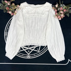 Crafted from breathable cotton, this charming short-sleeve blouse features a classic Peter Pan collar and delicate bow tie. The playful plaid pattern in multiple colors offers versatile styling for both Lolita and JK fashion. Its lightweight comfort and sweet design make it ideal for daily wear, effortlessly pairing with jumpers, skirts, or dresses for a fresh, youthful look.