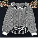 Crafted from breathable cotton, this charming short-sleeve blouse features a classic Peter Pan collar and delicate bow tie. The playful plaid pattern in multiple colors offers versatile styling for both Lolita and JK fashion. Its lightweight comfort and sweet design make it ideal for daily wear, effortlessly pairing with jumpers, skirts, or dresses for a fresh, youthful look.