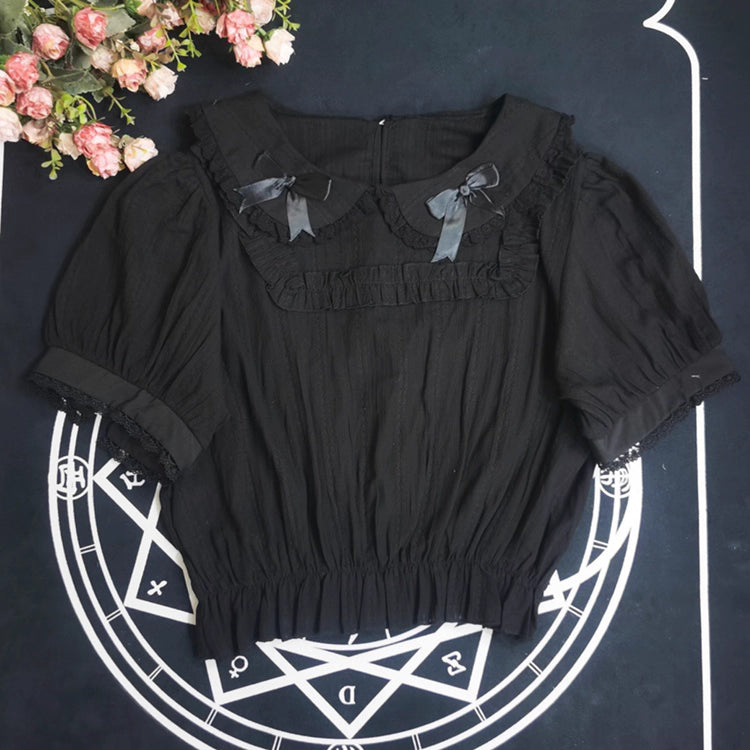 Crafted from breathable cotton, this charming short-sleeve blouse features a classic Peter Pan collar and delicate bow tie. The playful plaid pattern in multiple colors offers versatile styling for both Lolita and JK fashion. Its lightweight comfort and sweet design make it ideal for daily wear, effortlessly pairing with jumpers, skirts, or dresses for a fresh, youthful look.