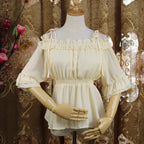 Inspired by Japanese sweet style, this airy chiffon blouse features a delicate halter neck and playful bubble sleeves. The lightweight fabric drapes softly for a dreamy silhouette, perfect for layering under sundresses or jumpers. Its whimsical design combines youthful charm with elegant details, making it ideal for creating kawaii Lolita coordinates with a touch of romantic freshness.