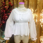 Inspired by Japanese sweet style, this airy chiffon blouse features a delicate halter neck and playful bubble sleeves. The lightweight fabric drapes softly for a dreamy silhouette, perfect for layering under sundresses or jumpers. Its whimsical design combines youthful charm with elegant details, making it ideal for creating kawaii Lolita coordinates with a touch of romantic freshness.