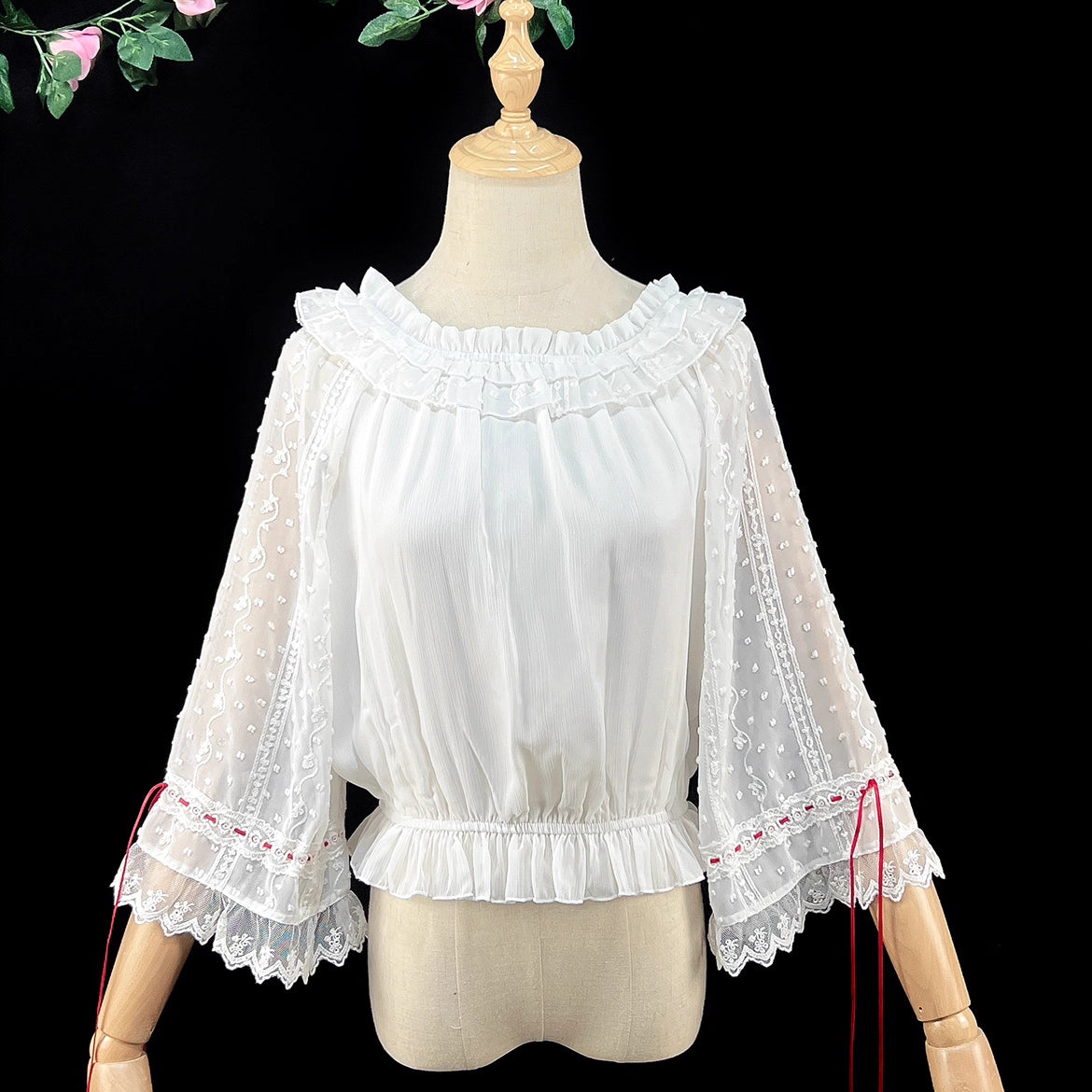 Embrace dark elegance with our Gothic Lolita chiffon blouse, blending poetic mystery and delicate romance. Lightweight and breathable for summer, it features dramatic flared sleeves with adjustable drawstring cuffs for a customizable silhouette. The contrasting black and white palette adds timeless sophistication. Perfect for layering or standalone wear, this piece captures the essence of ethereal beauty and subtle rebellion, ideal for those who dare to merge fantasy with fashion. Crafted for comfort and st