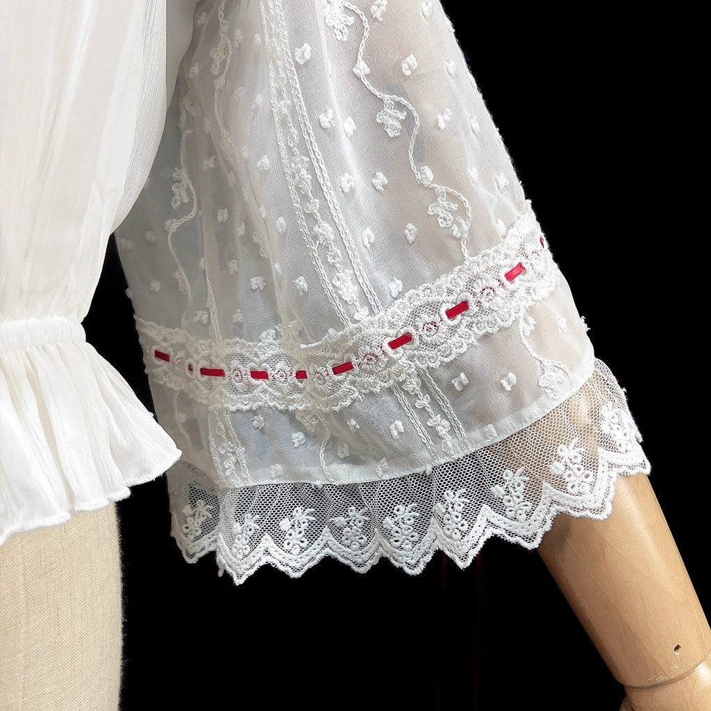 Embrace dark elegance with our Gothic Lolita chiffon blouse, blending poetic mystery and delicate romance. Lightweight and breathable for summer, it features dramatic flared sleeves with adjustable drawstring cuffs for a customizable silhouette. The contrasting black and white palette adds timeless sophistication. Perfect for layering or standalone wear, this piece captures the essence of ethereal beauty and subtle rebellion, ideal for those who dare to merge fantasy with fashion. Crafted for comfort and st