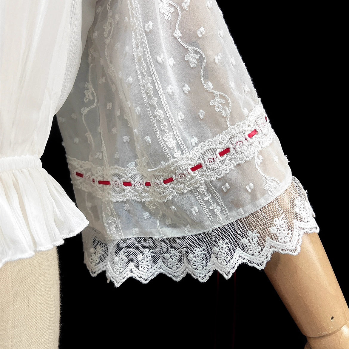 Embrace dark elegance with our Gothic Lolita chiffon blouse, blending poetic mystery and delicate romance. Lightweight and breathable for summer, it features dramatic flared sleeves with adjustable drawstring cuffs for a customizable silhouette. The contrasting black and white palette adds timeless sophistication. Perfect for layering or standalone wear, this piece captures the essence of ethereal beauty and subtle rebellion, ideal for those who dare to merge fantasy with fashion. Crafted for comfort and st