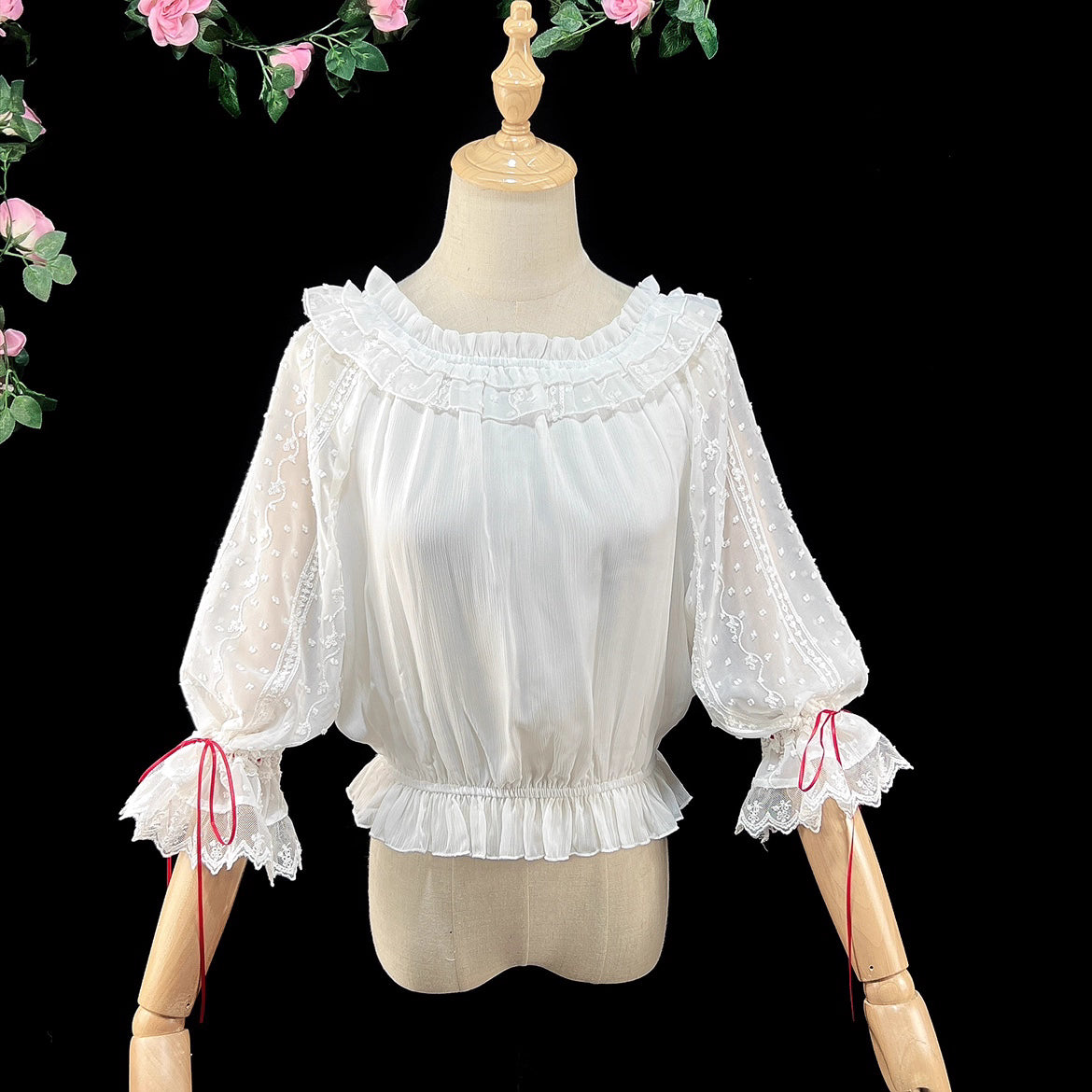 Embrace dark elegance with our Gothic Lolita chiffon blouse, blending poetic mystery and delicate romance. Lightweight and breathable for summer, it features dramatic flared sleeves with adjustable drawstring cuffs for a customizable silhouette. The contrasting black and white palette adds timeless sophistication. Perfect for layering or standalone wear, this piece captures the essence of ethereal beauty and subtle rebellion, ideal for those who dare to merge fantasy with fashion. Crafted for comfort and st