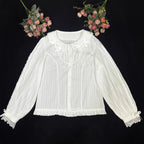 Crafted from soft cotton, this classic blouse features a charming Peter Pan collar adorned with a delicate bow. Rendered in versatile black, white, and peach, its breathable fabric and sweet design offer comfort for daily wear. The timeless elegance makes it perfect for layering under jumpers or dresses, blending practicality with romantic Lolita charm for year-round coordinations.