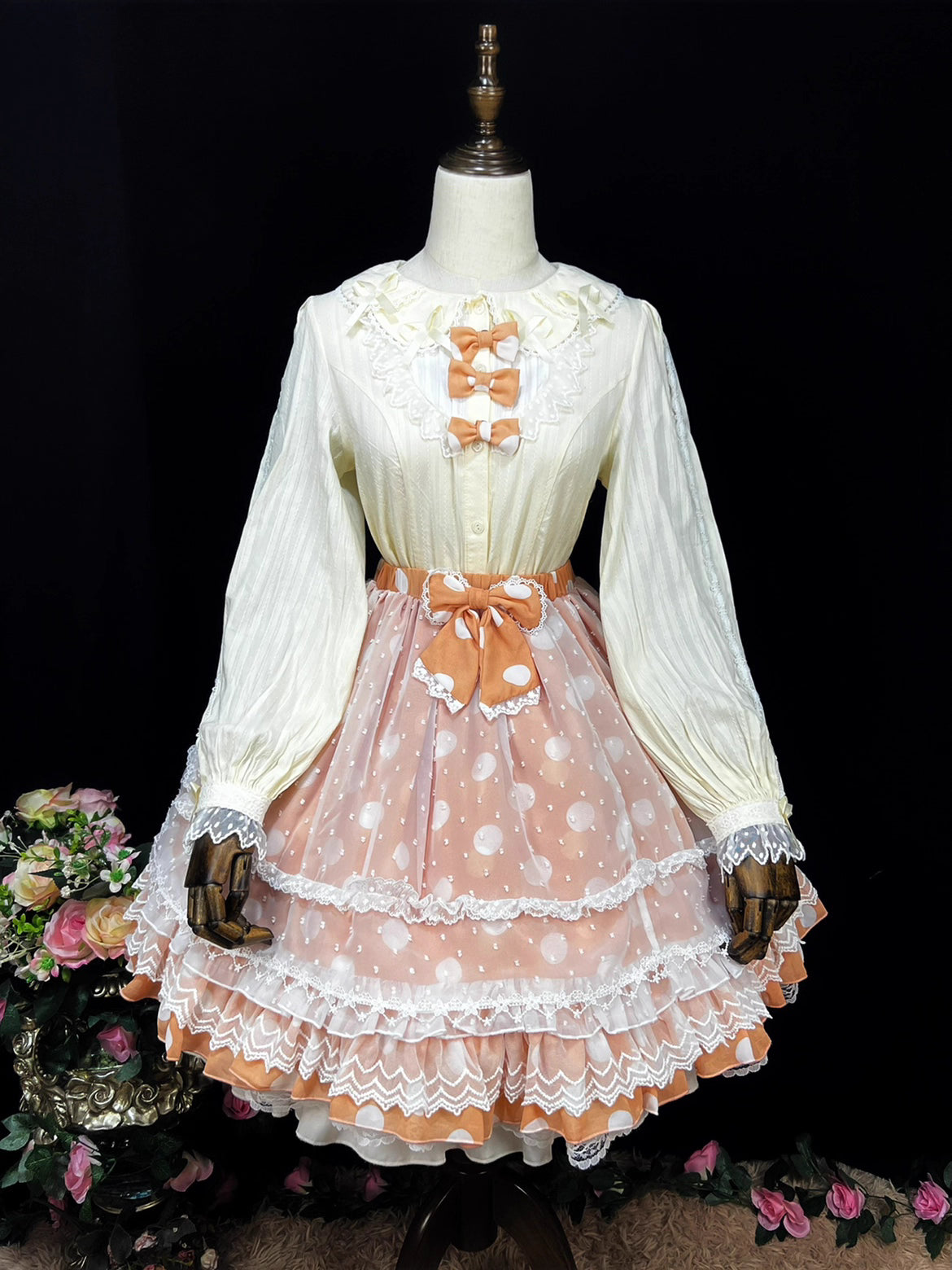 Crafted from soft cotton, this classic blouse features a charming Peter Pan collar adorned with a delicate bow. Rendered in versatile black, white, and peach, its breathable fabric and sweet design offer comfort for daily wear. The timeless elegance makes it perfect for layering under jumpers or dresses, blending practicality with romantic Lolita charm for year-round coordinations.