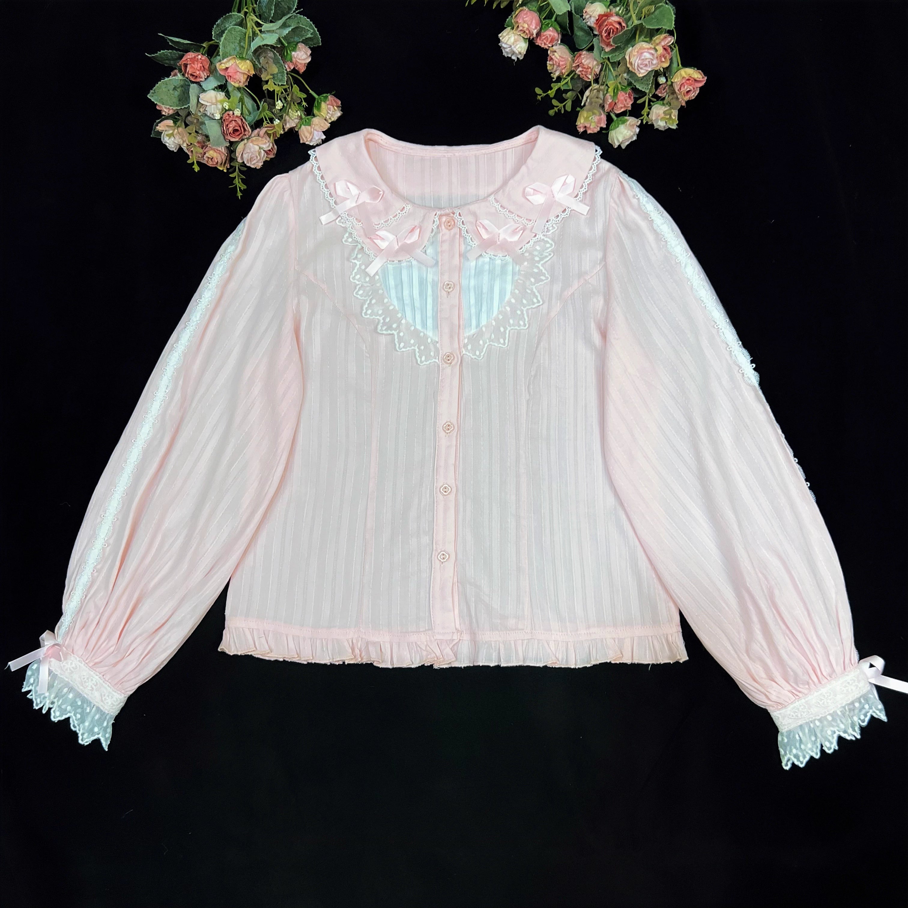 Crafted from soft cotton, this classic blouse features a charming Peter Pan collar adorned with a delicate bow. Rendered in versatile black, white, and peach, its breathable fabric and sweet design offer comfort for daily wear. The timeless elegance makes it perfect for layering under jumpers or dresses, blending practicality with romantic Lolita charm for year-round coordinations.