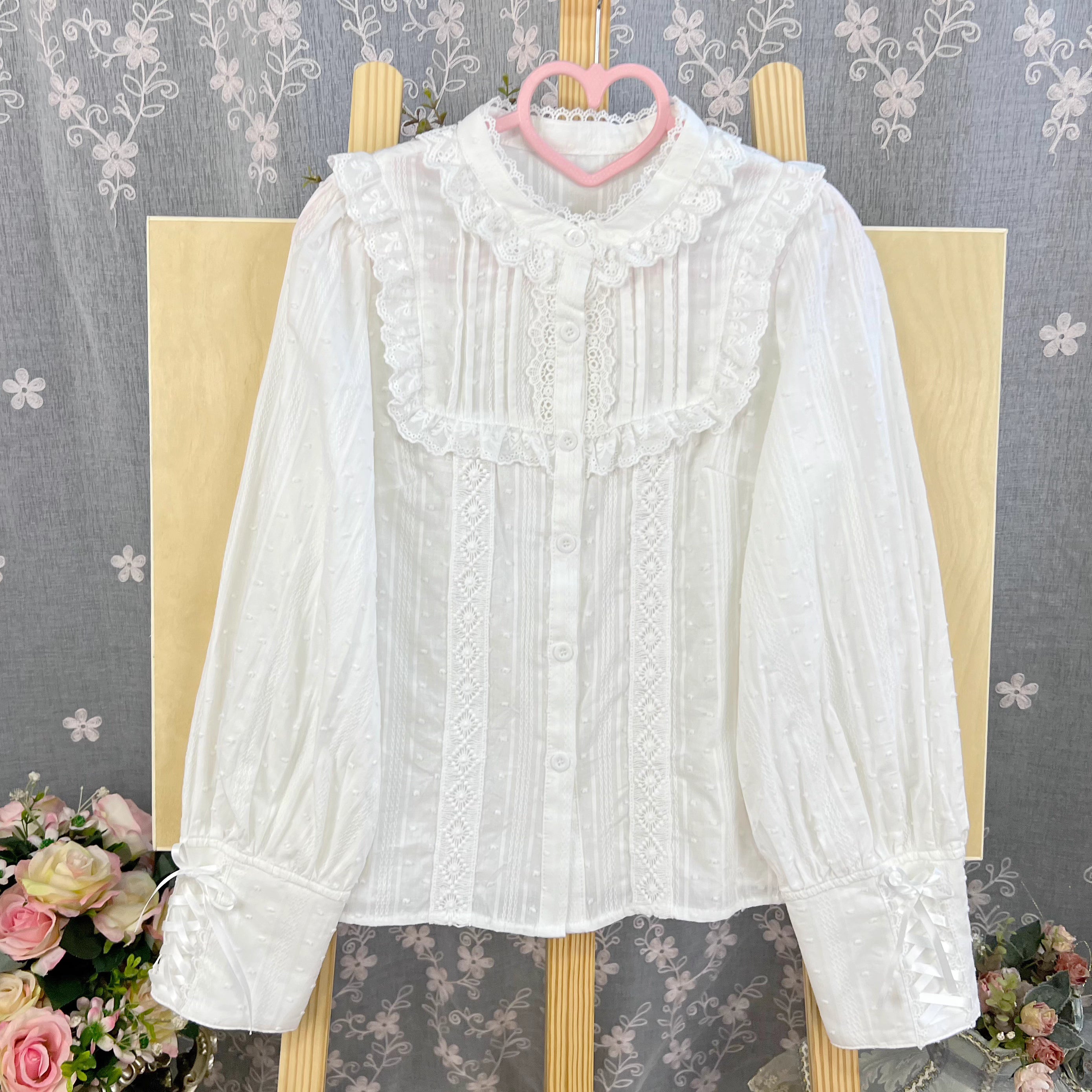 Design Concept:
This Lolita blouse is crafted from soft, breathable cotton, featuring a charming stand collar and long sleeves for a refined yet sweet look. Available in&nbsp;Beige, Black, and White, it combines classic Lolita elegance with a playful, doll-like aesthetic. The tailored silhouette and delicate detailing make it perfect for layering under jumpers, dresses, or wearing on its own for daily outings or tea parties.