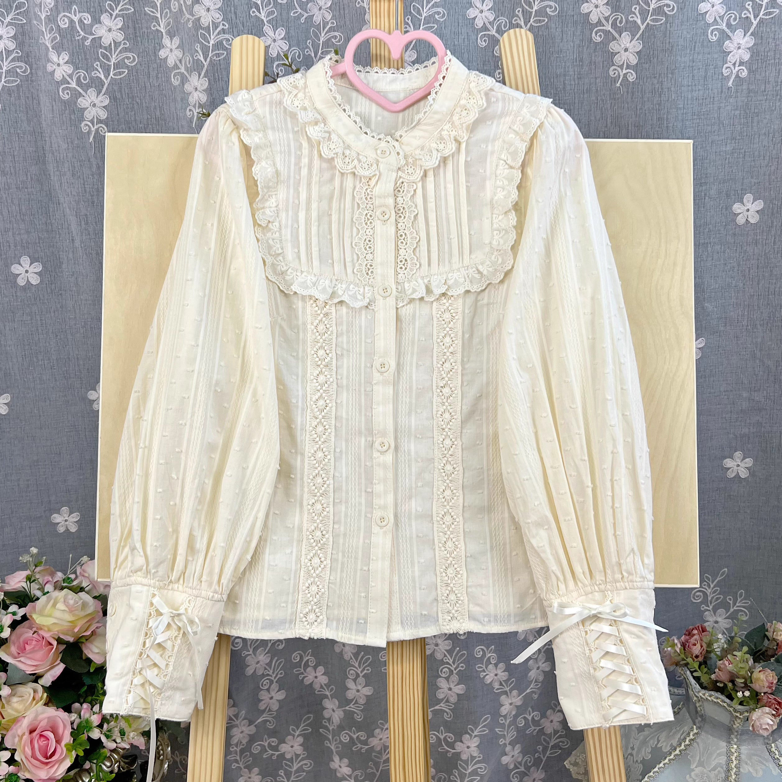 Design Concept:
This Lolita blouse is crafted from soft, breathable cotton, featuring a charming stand collar and long sleeves for a refined yet sweet look. Available in&nbsp;Beige, Black, and White, it combines classic Lolita elegance with a playful, doll-like aesthetic. The tailored silhouette and delicate detailing make it perfect for layering under jumpers, dresses, or wearing on its own for daily outings or tea parties.