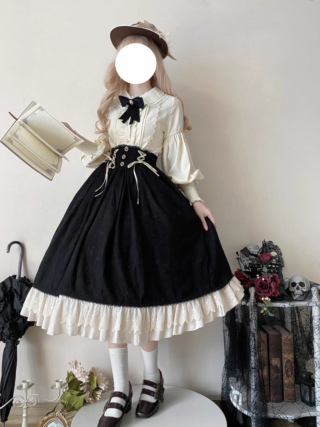 This Lolita blouse combines vintage CLA-inspired elegance with court-style sophistication. Featuring a delicate doll collar and refined tailoring, it adds a charming, graceful touch to any Lolita outfit. Available in Beige, Black, and White, this blouse is perfect as a layering piece under jumpers, dresses, or worn on its own for daily wear and tea parties.