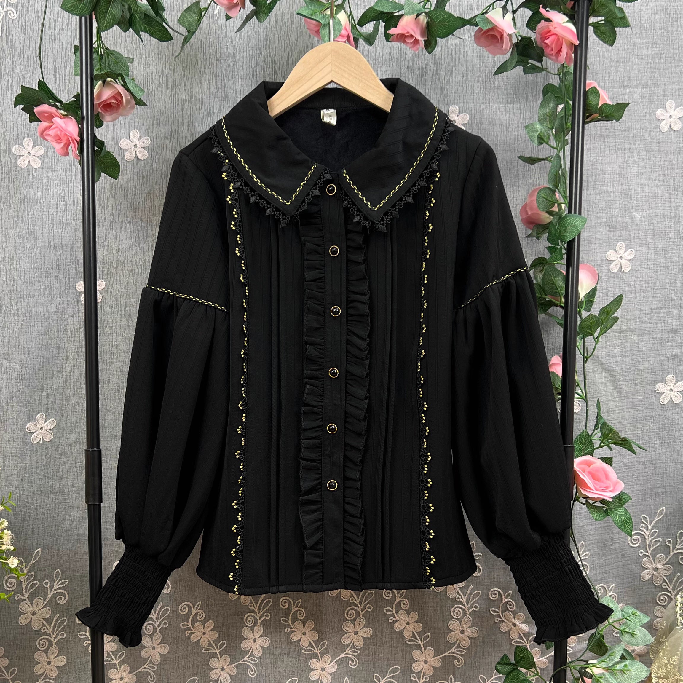 This Lolita blouse combines vintage CLA-inspired elegance with court-style sophistication. Featuring a delicate doll collar and refined tailoring, it adds a charming, graceful touch to any Lolita outfit. Available in Beige, Black, and White, this blouse is perfect as a layering piece under jumpers, dresses, or worn on its own for daily wear and tea parties.