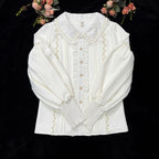 This Lolita blouse combines vintage CLA-inspired elegance with court-style sophistication. Featuring a delicate doll collar and refined tailoring, it adds a charming, graceful touch to any Lolita outfit. Available in Beige, Black, and White, this blouse is perfect as a layering piece under jumpers, dresses, or worn on its own for daily wear and tea parties.