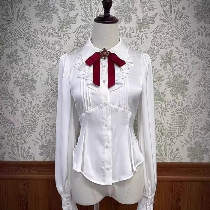Inspired by the delicate charm of a dollhouse aesthetic, this long-sleeve Lolita blouse combines minimalist elegance with functional design. Crafted in pure white and classic black with a graceful drape, it features adjustable tie details for customizable silhouettes. The versatile piece offers a comfortable fit for daily wear, effortlessly layering under jumpers or pairing with high-waisted skirts. Its subtle sophistication makes it ideal for both sweet and Gothic Lolita coordinations, blending timeless pu