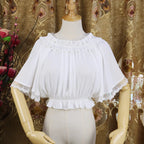 Named "Feiyang", this blouse captures movement and grace with its flowing chiffon fabric and delicate flutter sleeves. The airy design creates an ethereal silhouette, perfect for layering under jumpers or dresses. Its minimalist yet magical style blends softness and lightness, making it ideal for adding a touch of fairy-like elegance to sweet or classic Lolita coordinates.