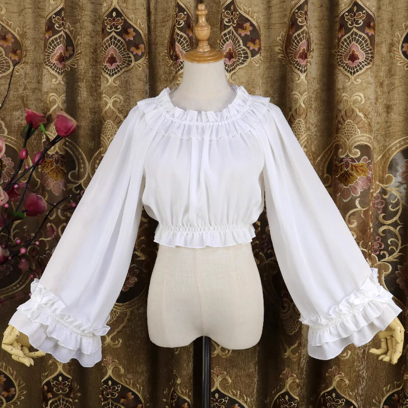 This flowing chiffon blouse combines delicate details with dramatic flared sleeves. Rendered in classic black, white, and bold red, its loose round neck design offers comfortable versatility for layering under JSKs or jumpers. The lightweight fabric and romantic silhouette create an elegant yet functional piece, perfect for adding dynamic movement and vintage charm to both sweet and Gothic Lolita coordinations.