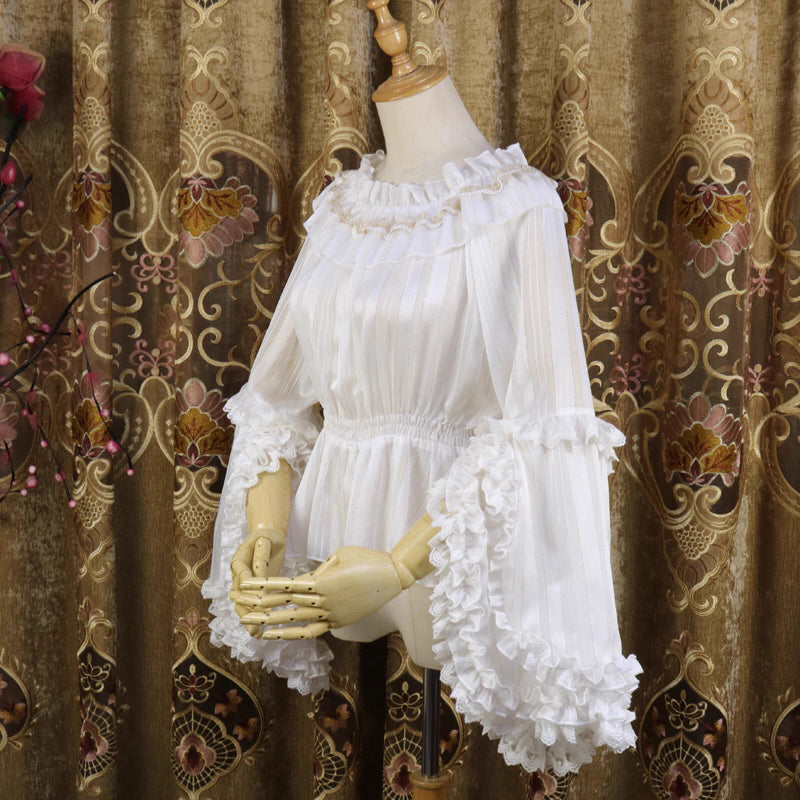 This elegant blouse combines luxurious gold-trimmed stripes with flowing chiffon fabric and dramatic sleeves. The metallic accents catch the light beautifully, adding opulence to the delicate striped pattern. Perfect for layering, it creates a sophisticated foundation for both classic and aristocratic Lolita styles, blending regal charm with timeless elegance.