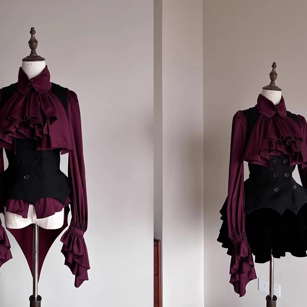Step into Victorian elegance with this Gothic Lolita blouse. Delicate ruffles frame the Peter Pan collar and cascade down the front, while billowy bishop sleeves add dramatic flair. Crafted from premium opaque fabric, this retro-inspired top features intricate lace detailing and a tailored fit. Available in classic black, vampy red, and pristine white, it serves as the perfect layering piece for JSKs or a statement standalone top. Embrace dark romance with this timeless essential.
