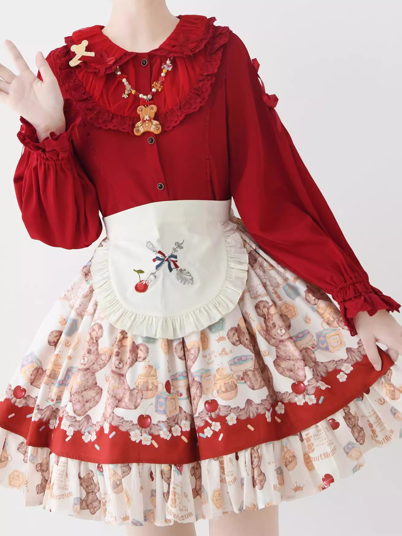 This exquisite Lolita blouse showcases a heavily detailed Peter Pan collar with intricate lace and embroidery. Rendered in vibrant red, pure white, and classic black, its long sleeves and tailored fit offer a perfect balance of sweetness and sophistication. The luxurious craftsmanship makes it ideal for creating striking coordinations, blending doll-like charm with elegant versatility for both daily wear and special occasions.