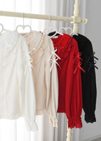 This exquisite Lolita blouse showcases a heavily detailed Peter Pan collar with intricate lace and embroidery. Rendered in vibrant red, pure white, and classic black, its long sleeves and tailored fit offer a perfect balance of sweetness and sophistication. The luxurious craftsmanship makes it ideal for creating striking coordinations, blending doll-like charm with elegant versatility for both daily wear and special occasions.