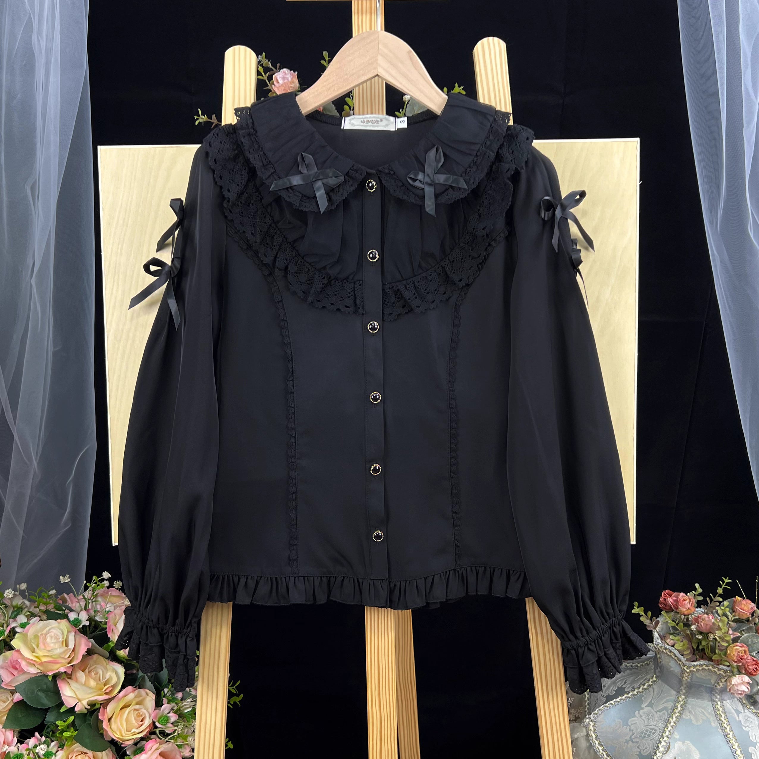This exquisite Lolita blouse showcases a heavily detailed Peter Pan collar with intricate lace and embroidery. Rendered in vibrant red, pure white, and classic black, its long sleeves and tailored fit offer a perfect balance of sweetness and sophistication. The luxurious craftsmanship makes it ideal for creating striking coordinations, blending doll-like charm with elegant versatility for both daily wear and special occasions.