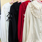 This exquisite Lolita blouse showcases a heavily detailed Peter Pan collar with intricate lace and embroidery. Rendered in vibrant red, pure white, and classic black, its long sleeves and tailored fit offer a perfect balance of sweetness and sophistication. The luxurious craftsmanship makes it ideal for creating striking coordinations, blending doll-like charm with elegant versatility for both daily wear and special occasions.