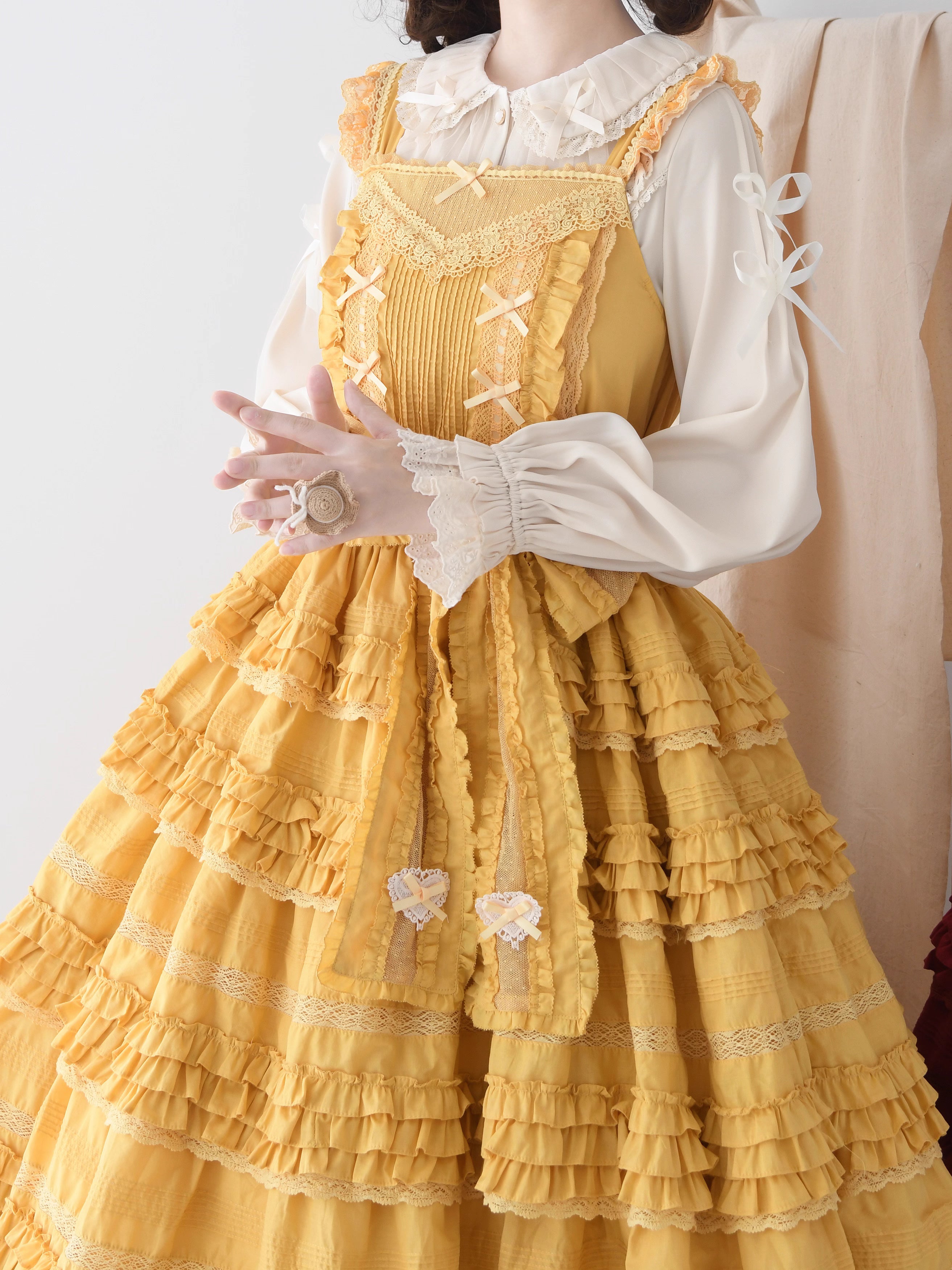 This exquisite Lolita blouse showcases a heavily detailed Peter Pan collar with intricate lace and embroidery. Rendered in vibrant red, pure white, and classic black, its long sleeves and tailored fit offer a perfect balance of sweetness and sophistication. The luxurious craftsmanship makes it ideal for creating striking coordinations, blending doll-like charm with elegant versatility for both daily wear and special occasions.
