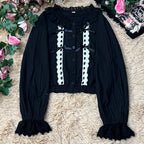 This short-cut cotton blouse features a flattering high-waist design and an elastic hem adorned with delicate ruffles. Crafted in versatile black and sweet pink, its breathable fabric and tailored fit offer comfort for daily wear. The cropped length perfectly pairs with high-waisted skirts or jumpers, blending playful charm with practical elegance for cute Lolita coordinates.