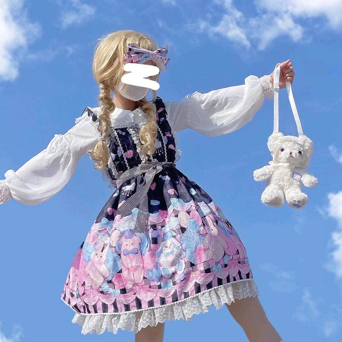 Embodying the freshness of spring, this delicate blouse features a lace-trimmed doll collar adorned with satin ribbons and soft bishop sleeves. The lightweight fabric and sweet design make it perfect for layering under jumpers or dresses. Its romantic details capture a whimsical, youthful charm, ideal for creating enchanting coordinations that blend vintage elegance with modern Lolita sweetness.