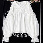 Embodying the freshness of spring, this delicate blouse features a lace-trimmed doll collar adorned with satin ribbons and soft bishop sleeves. The lightweight fabric and sweet design make it perfect for layering under jumpers or dresses. Its romantic details capture a whimsical, youthful charm, ideal for creating enchanting coordinations that blend vintage elegance with modern Lolita sweetness.