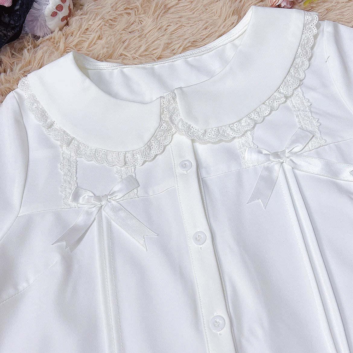 Designed for summer comfort, this sweet Lolita blouse features a classic Peter Pan collar and breezy short sleeves. The lightweight fabric and playful design make it perfect for both casual JK styles and cute Lolita coordinates. Its versatile charm blends effortless daily wear with dreamy elegance, offering a fresh and youthful look for warm-weather fashion.