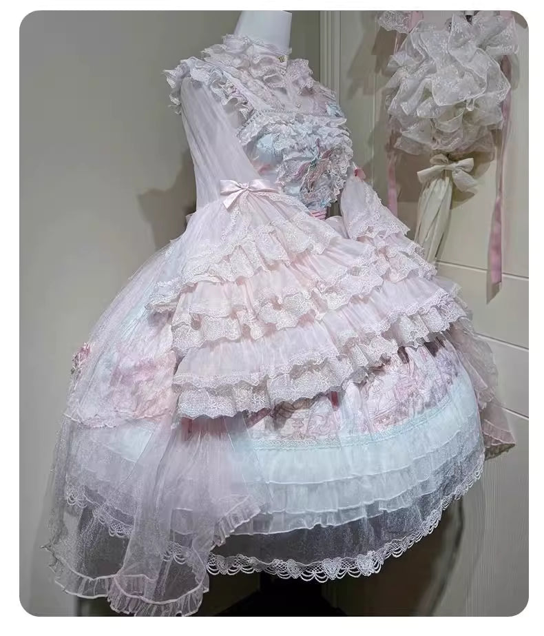 This dreamy Lolita blouse features soft puff sleeves and delicate sheer mesh detailing in blush pink and peach tones. Designed for daily wear, its lightweight fabric offers comfortable layering under JSKs or jumpers. The sweet yet versatile design balances elegance with practicality, perfect for creating charmingly coordinations with a touch of ethereal romance.