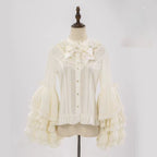 This dreamy Lolita blouse features soft puff sleeves and delicate sheer mesh detailing in blush pink and peach tones. Designed for daily wear, its lightweight fabric offers comfortable layering under JSKs or jumpers. The sweet yet versatile design balances elegance with practicality, perfect for creating charmingly coordinations with a touch of ethereal romance.