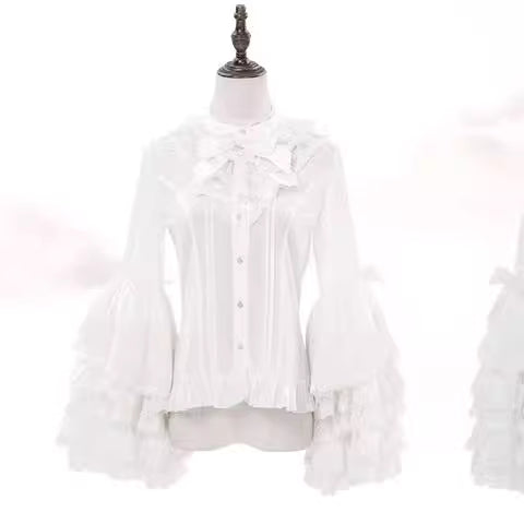 This dreamy Lolita blouse features soft puff sleeves and delicate sheer mesh detailing in blush pink and peach tones. Designed for daily wear, its lightweight fabric offers comfortable layering under JSKs or jumpers. The sweet yet versatile design balances elegance with practicality, perfect for creating charmingly coordinations with a touch of ethereal romance.