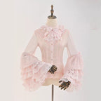 This dreamy Lolita blouse features soft puff sleeves and delicate sheer mesh detailing in blush pink and peach tones. Designed for daily wear, its lightweight fabric offers comfortable layering under JSKs or jumpers. The sweet yet versatile design balances elegance with practicality, perfect for creating charmingly coordinations with a touch of ethereal romance.