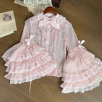 This dreamy Lolita blouse features soft puff sleeves and delicate sheer mesh detailing in blush pink and peach tones. Designed for daily wear, its lightweight fabric offers comfortable layering under JSKs or jumpers. The sweet yet versatile design balances elegance with practicality, perfect for creating charmingly coordinations with a touch of ethereal romance.