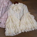 This dreamy Lolita blouse features soft puff sleeves and delicate sheer mesh detailing in blush pink and peach tones. Designed for daily wear, its lightweight fabric offers comfortable layering under JSKs or jumpers. The sweet yet versatile design balances elegance with practicality, perfect for creating charmingly coordinations with a touch of ethereal romance.