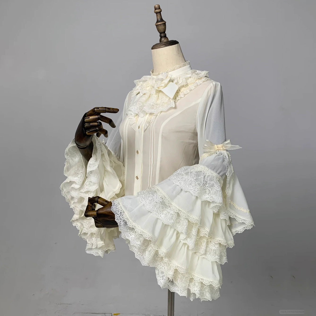 This dreamy Lolita blouse features soft puff sleeves and delicate sheer mesh detailing in blush pink and peach tones. Designed for daily wear, its lightweight fabric offers comfortable layering under JSKs or jumpers. The sweet yet versatile design balances elegance with practicality, perfect for creating charmingly coordinations with a touch of ethereal romance.