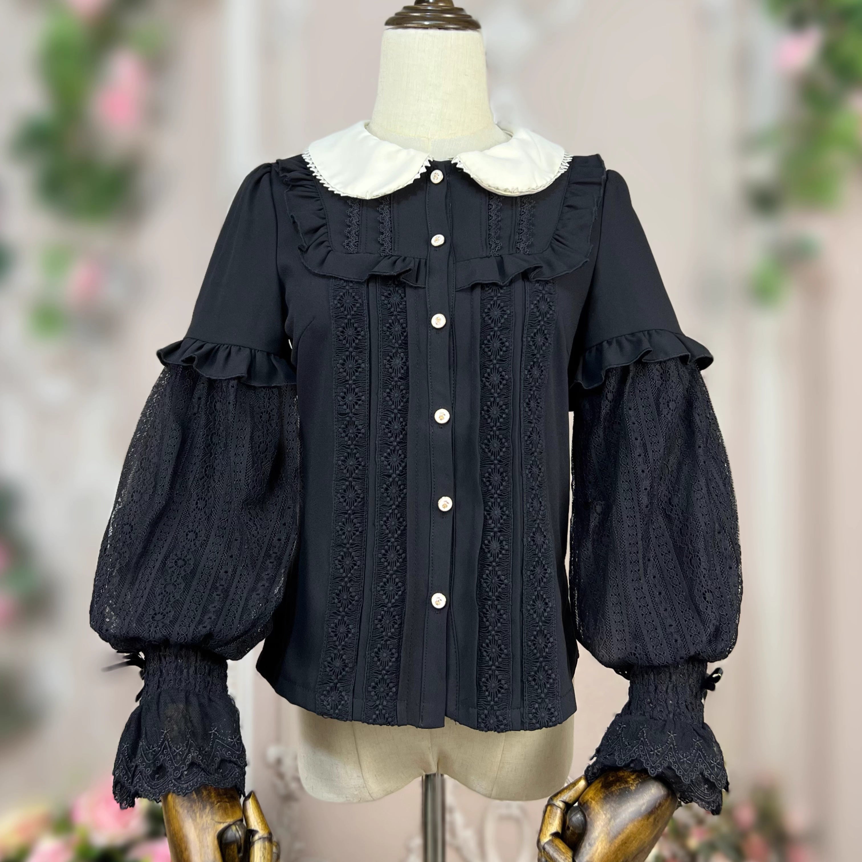 This elegant Lolita blouse combines a classic doll collar with soft bishop sleeves, creating a timeless silhouette. Designed with delicate details and a tailored fit, it offers versatile layering under jumpers or dresses. The refined design balances vintage charm and modern sweetness, perfect for adding romantic sophistication to both classic and sweet Lolita coordinates.