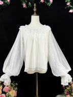 This elegant blouse combines sheer mesh fabric with dramatic leg-of-mutton sleeves and a comfortable elastic neckline. Perfect for spring and autumn layering, its lightweight texture adds depth to coordinates while maintaining a romantic silhouette. The design balances vintage inspiration with modern wearability, creating a versatile piece that transitions seamlessly from sweet to Gothic styles.