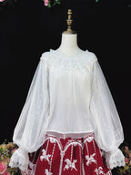 This elegant blouse combines sheer mesh fabric with dramatic leg-of-mutton sleeves and a comfortable elastic neckline. Perfect for spring and autumn layering, its lightweight texture adds depth to coordinates while maintaining a romantic silhouette. The design balances vintage inspiration with modern wearability, creating a versatile piece that transitions seamlessly from sweet to Gothic styles.