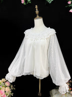 This elegant blouse combines sheer mesh fabric with dramatic leg-of-mutton sleeves and a comfortable elastic neckline. Perfect for spring and autumn layering, its lightweight texture adds depth to coordinates while maintaining a romantic silhouette. The design balances vintage inspiration with modern wearability, creating a versatile piece that transitions seamlessly from sweet to Gothic styles.