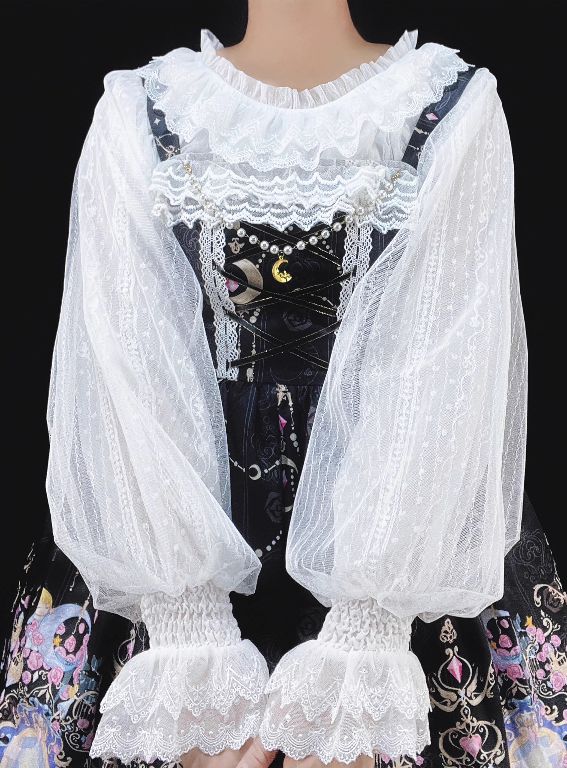 This elegant blouse combines sheer mesh fabric with dramatic leg-of-mutton sleeves and a comfortable elastic neckline. Perfect for spring and autumn layering, its lightweight texture adds depth to coordinates while maintaining a romantic silhouette. The design balances vintage inspiration with modern wearability, creating a versatile piece that transitions seamlessly from sweet to Gothic styles.