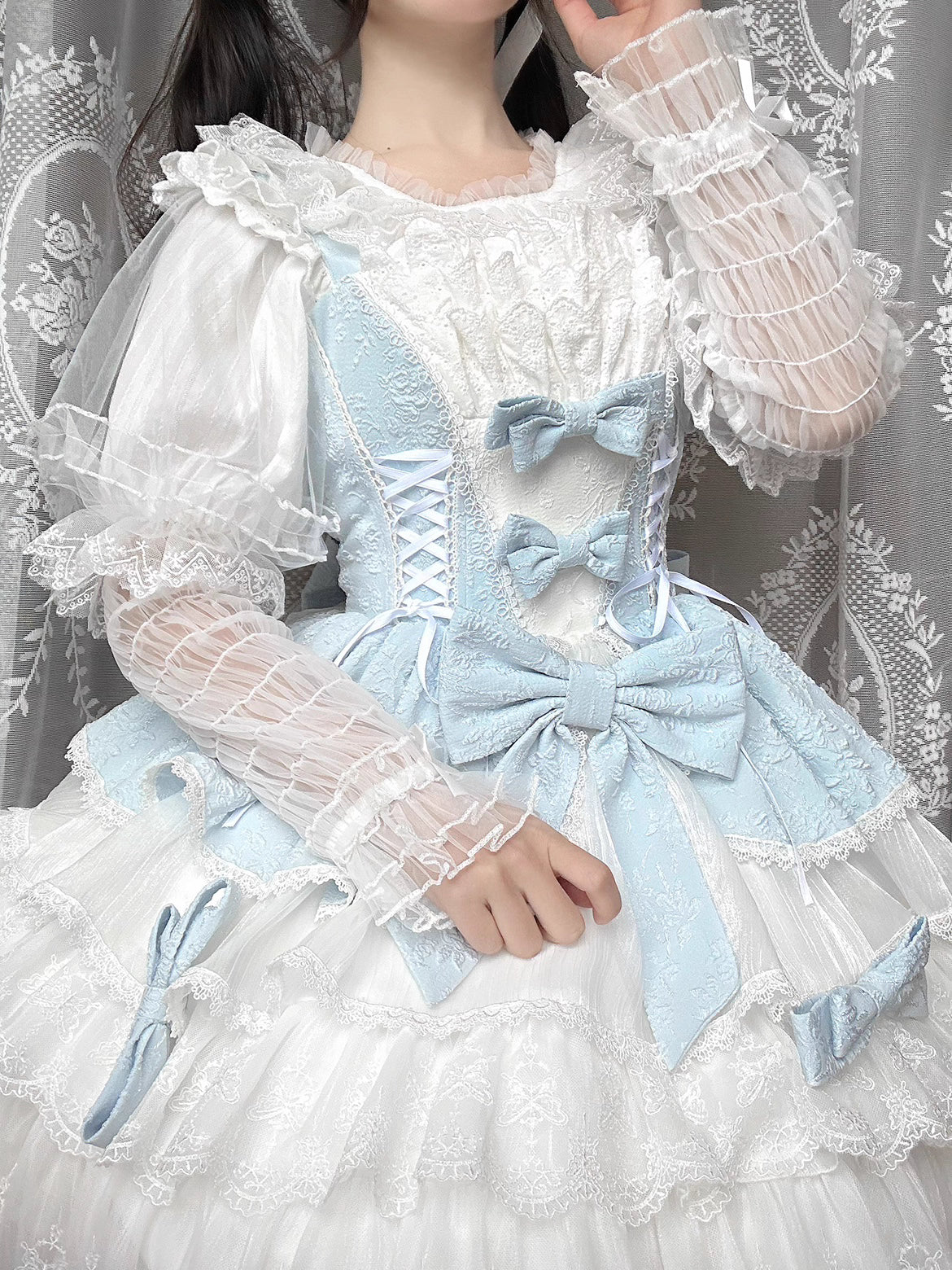 This retro-inspired blouse blends soft cotton with delicate mesh panels for textured elegance. The round neckline and relaxed fit offer timeless comfort, while subtle vintage details create a versatile layering piece. Perfect under jumpers or dresses, it effortlessly bridges classic and sweet Lolita styles with understated sophistication.