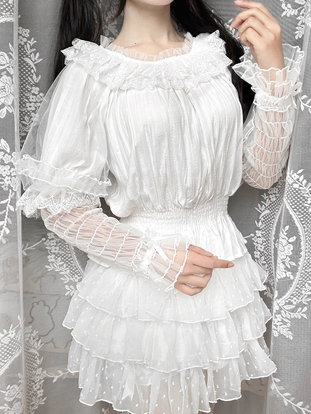 This retro-inspired blouse blends soft cotton with delicate mesh panels for textured elegance. The round neckline and relaxed fit offer timeless comfort, while subtle vintage details create a versatile layering piece. Perfect under jumpers or dresses, it effortlessly bridges classic and sweet Lolita styles with understated sophistication.